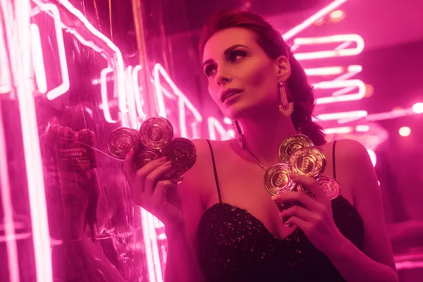 A glamorous woman holding casino chips in a neon-lit environment, representing the premium online casino atmosphere of 1777DET.